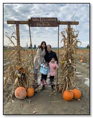 Darius and family Pumpkin arch 2