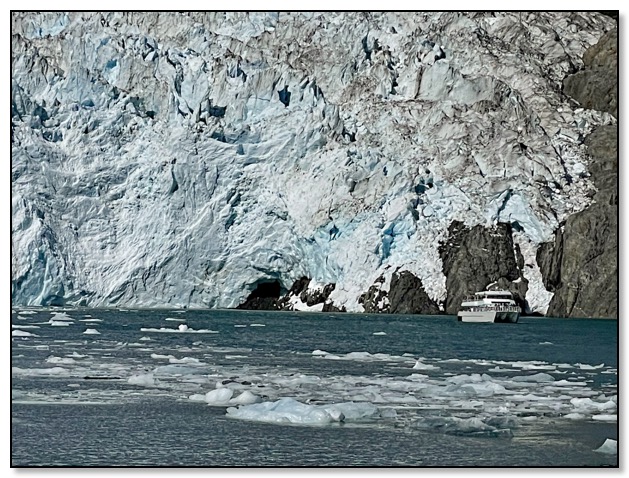 Aialik glacier with boat