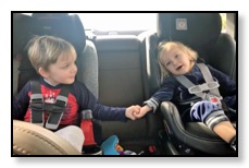 arrow and Tiger in car holding hands March 2018