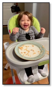 Auriane in highchair June 2020