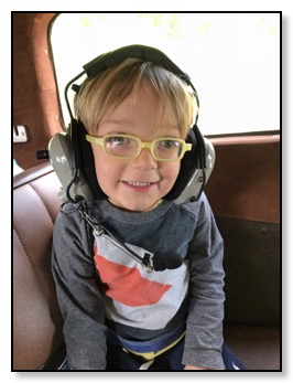 tiger in airplane with earphones Alaska June 2018